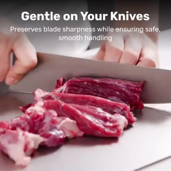 Chef slicing meat on the Katori titanium cutting board